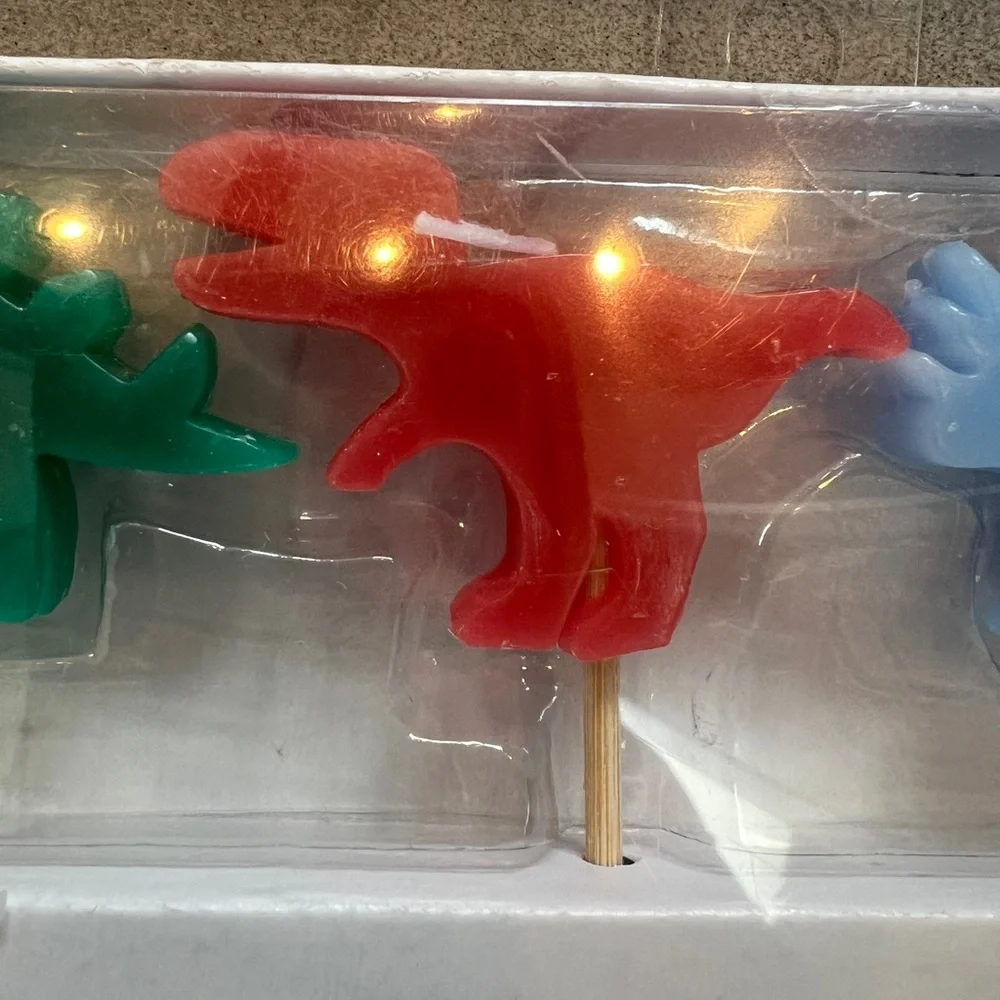 NWT Dinosaur Birthday Candles Set - each set has 4 candles approx 1”x2” each. 🦕